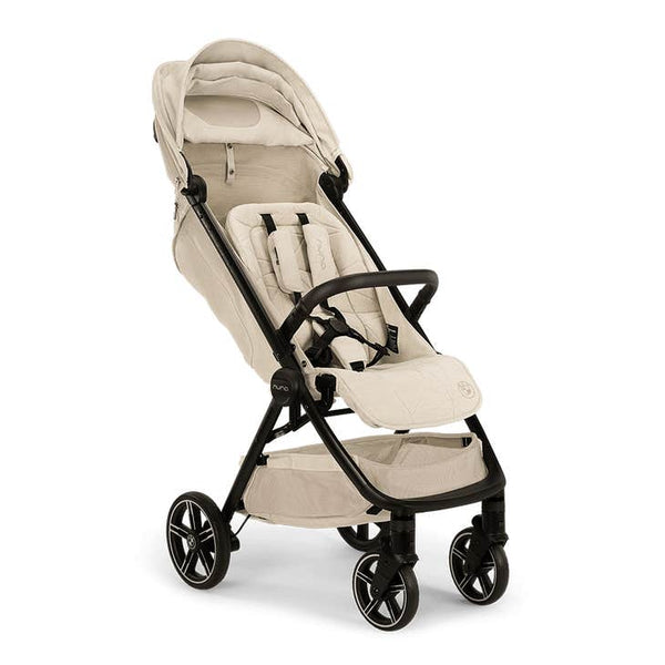 Nuna TRVL lx Compact Stroller with Travel Bag - Mica ( Delicate Neutral Beige BMW Logo)